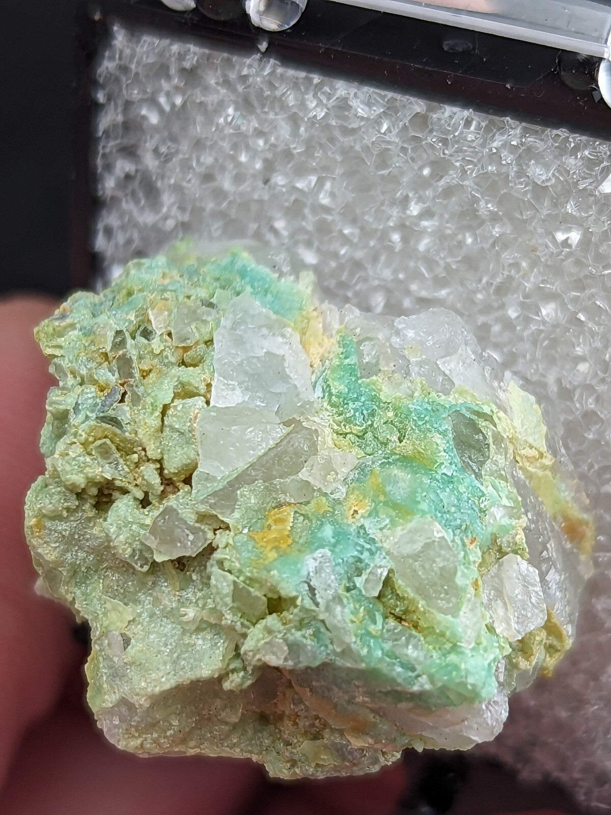 A vibrant green and translucent mineral specimen with crystalline formations.