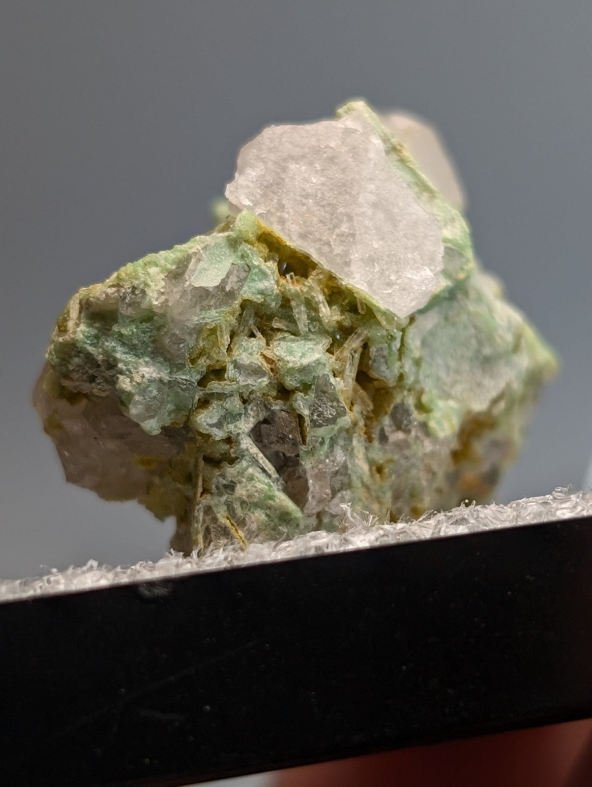 Wavellite on variscite mineral specimen with translucent green and white crystals in a mossy matrix from Arkansas
