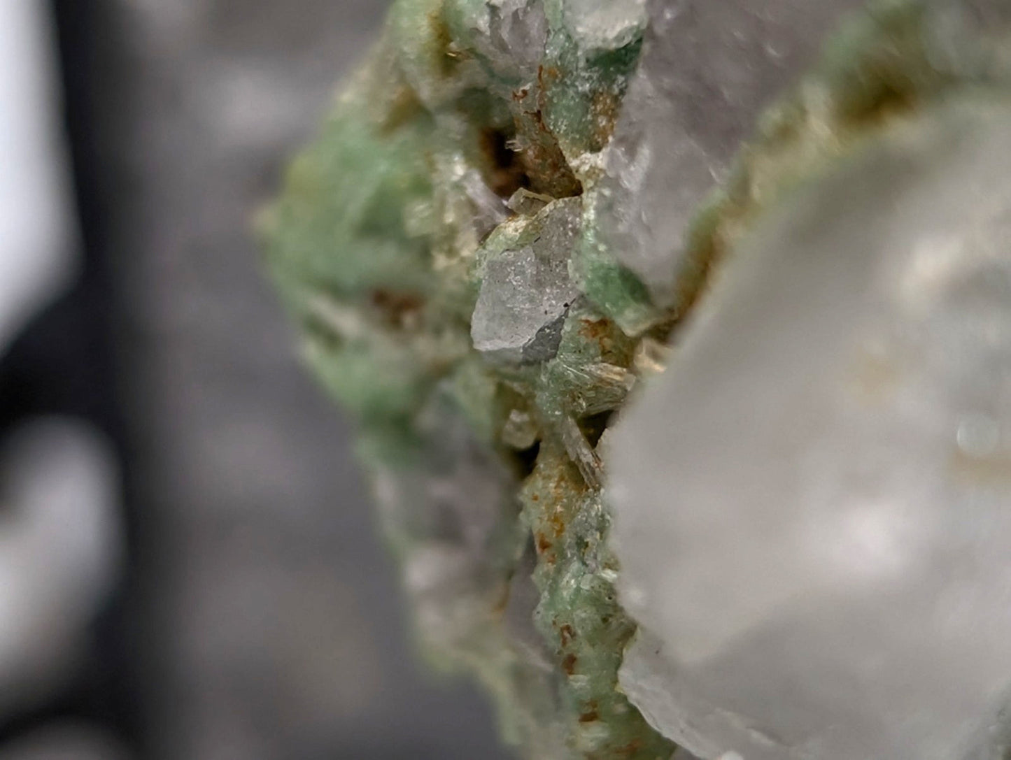 A translucent green and clear wavellite crystal cluster with jagged formations on variscite from Polk County Arkansas